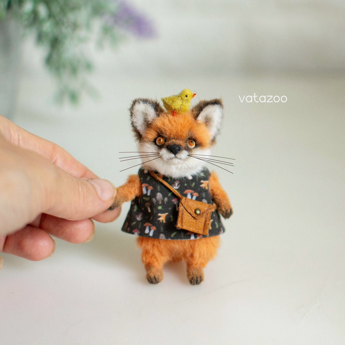 Miniature Fox with a Chick